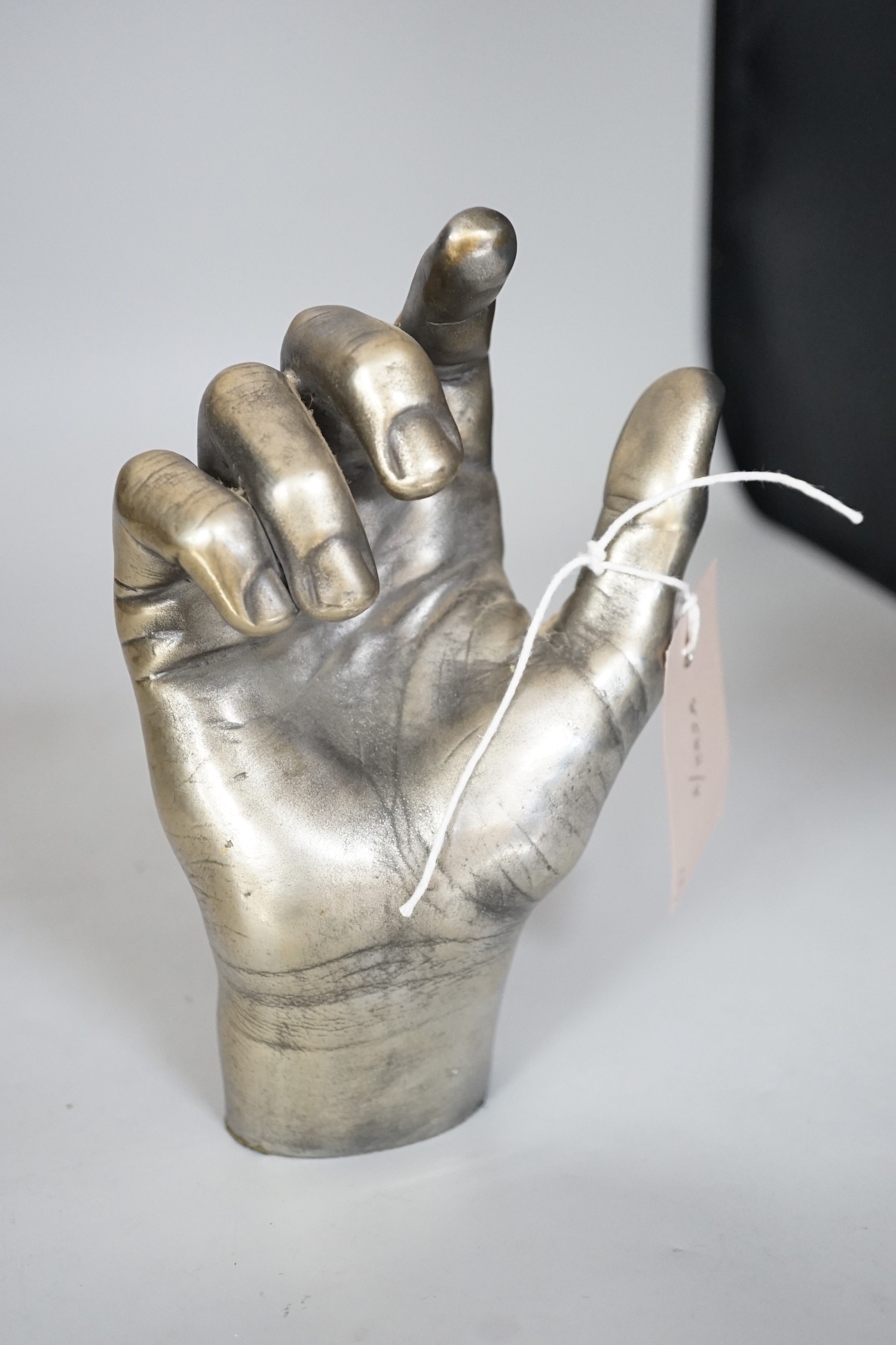 A limited edition life size bronze foot and two resin parts